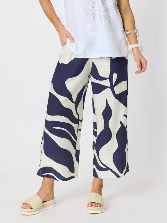 Image of a model wearing Pants. Product name - Bay Leaf Wide Leg Pant Navy Multi in Navy Multi colour by brand - Clarity