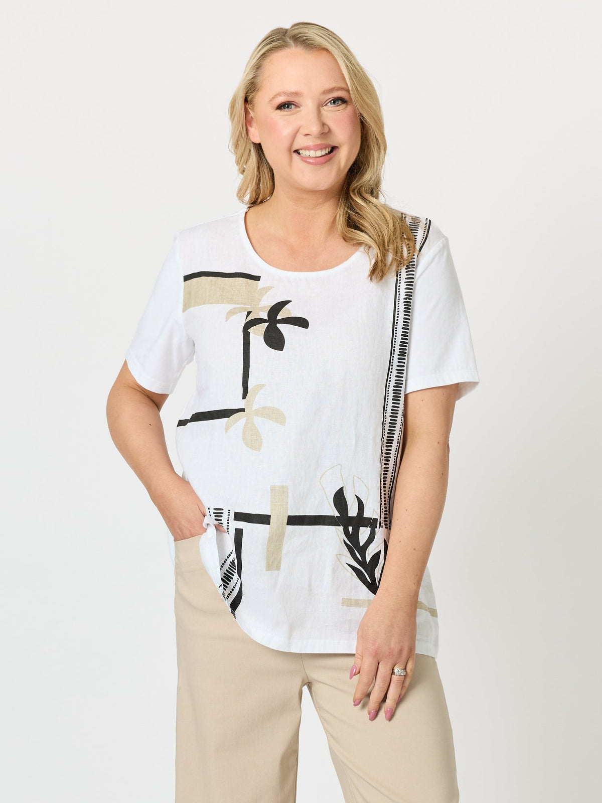 Image of a model wearing Tops. Product name - Bay Leaf Print Top White Mocha in White Mocha colour by brand - Clarity