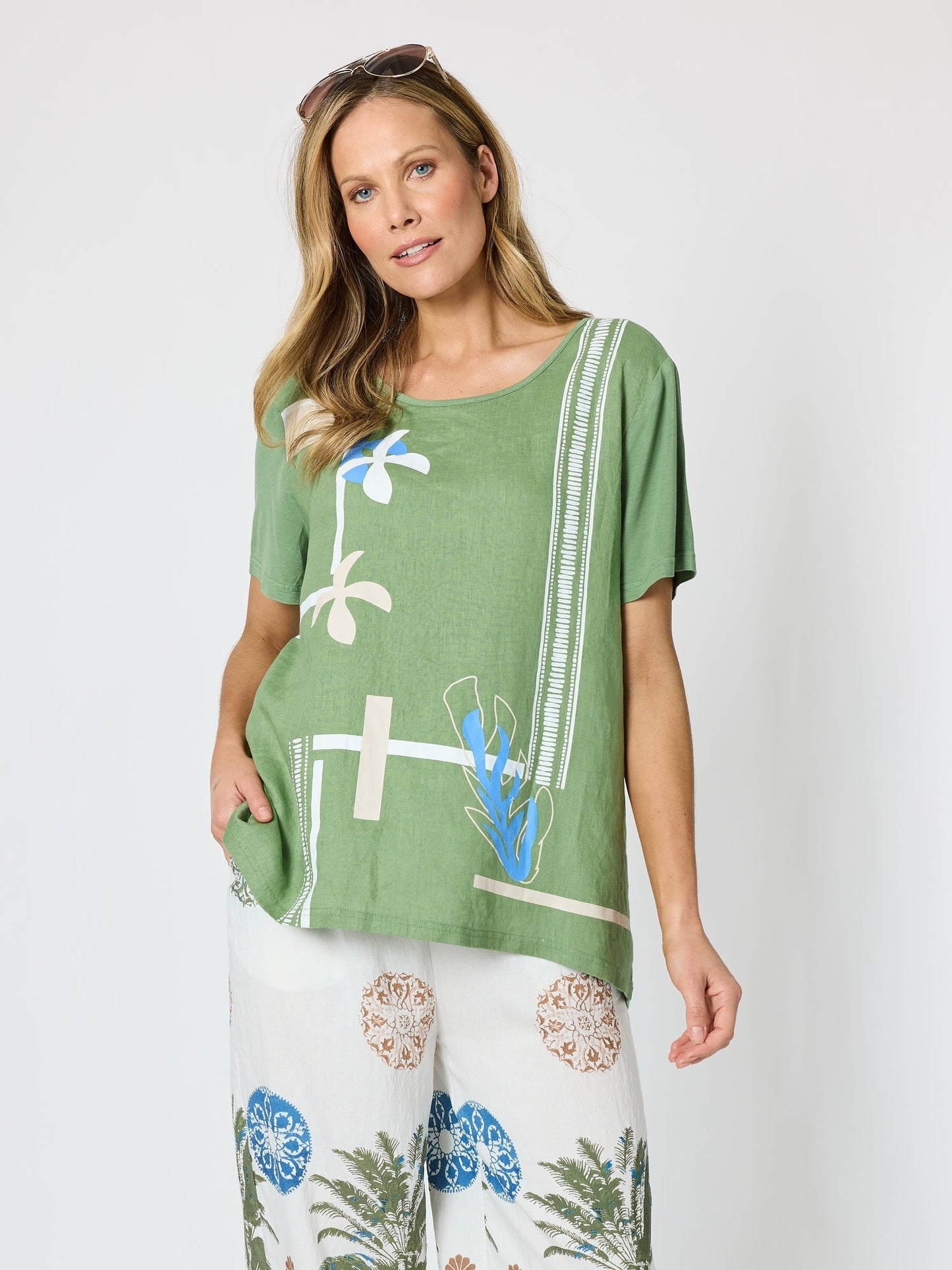 Image of a model wearing Tops. Product name - Bay Leaf Print Top Fern Multi in Fern Multi colour by brand - Clarity