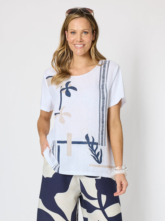 Image of a model wearing Tops. Product name - Bay Leaf Print Top White/Navy in White/Navy colour by brand - Clarity