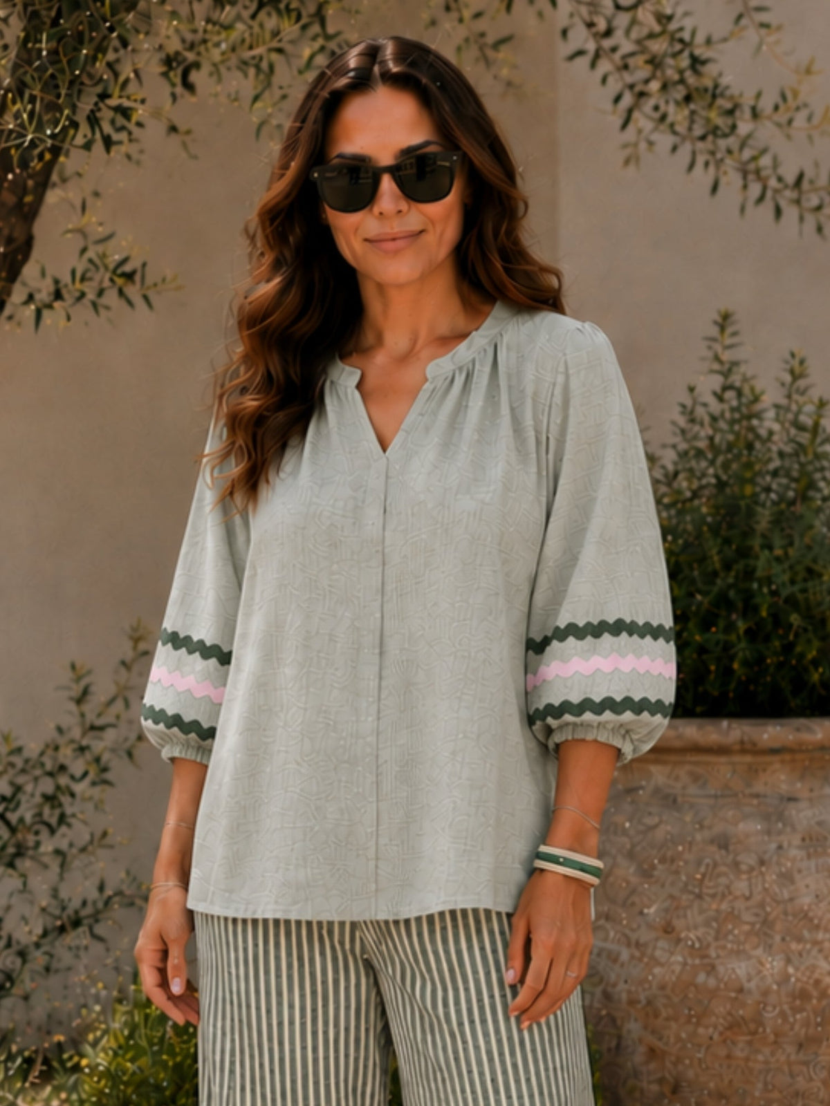 Image of a model wearing Tops. Product name - Canopy Ric Rac Top Olive in Olive colour by brand - Threadz