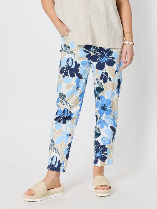 Image of a model wearing Pants. Product name - Amalfi Floral Rose Print Slim Leg Pant Cornflower Multi in Cornflower Multi colour by brand - Gordon Smith