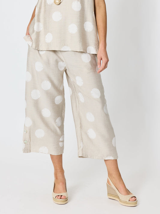 Image of a model wearing Pants. Product name - Riviera Spot Print Pant Natural/White in Natural/White colour by brand - Clarity