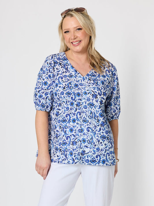 Image of a model wearing Tops. Product name - Monterey Floral Print Top Capri White in Capri White colour by brand - Gordon Smith