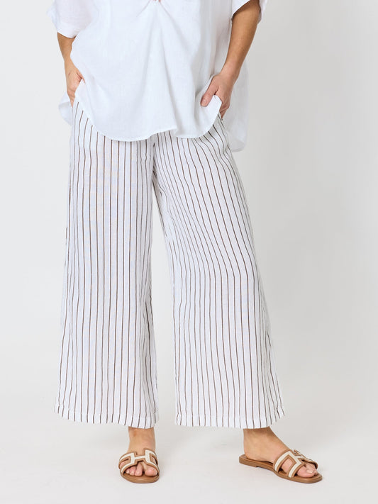 Image of a model wearing Pants. Product name - Haven Stripe Wide Leg Linen Pant Mocha White in Mocha White colour by brand - Hammock & Vine