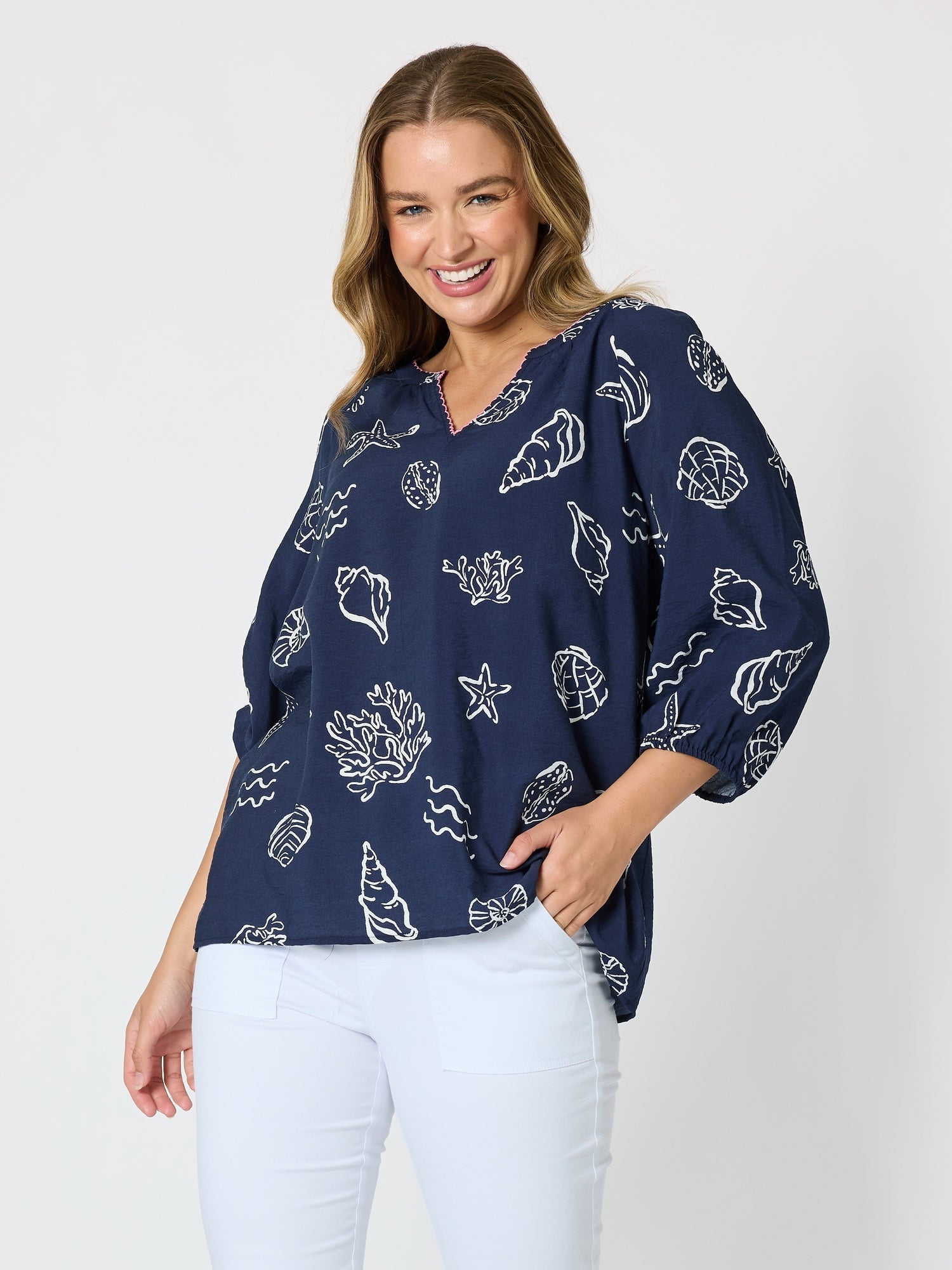 Image of a model wearing Tops. Product name - Montecito Print Top Navy/White in Navy/White colour by brand - Threadz