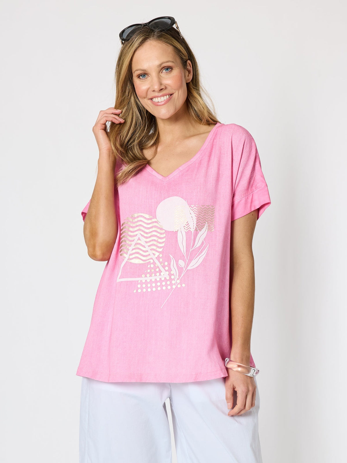 Image of a model wearing Tops. Product name - Orbit Print Top Pink in Pink colour by brand - Clarity