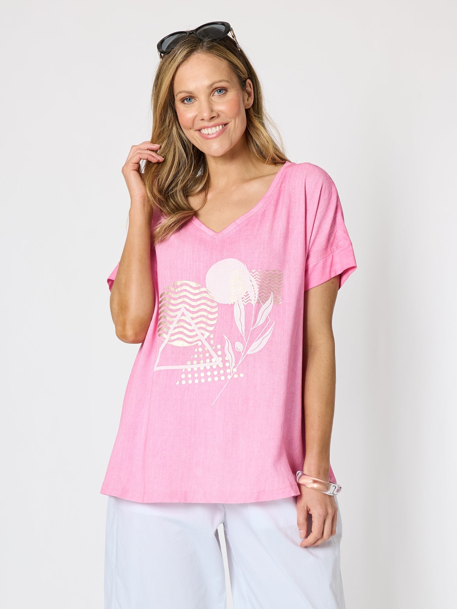 Image of a model wearing Tops. Product name - Orbit Print Top Pink in Pink colour by brand - Clarity