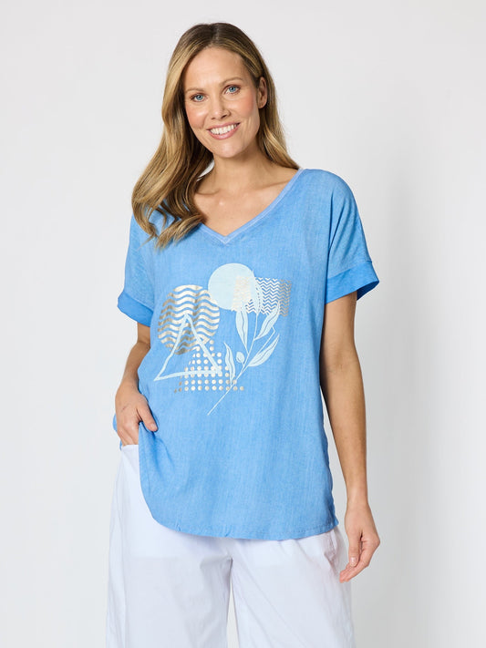 Image of a model wearing Tops. Product name - Orbit Print Top Sky Blue in Sky Blue colour by brand - Clarity