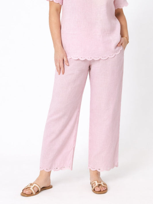 Image of a model wearing Pants. Product name - Lilly Scallop Hem Linen Pant Pale Pink in Pale Pink colour by brand - Gordon Smith