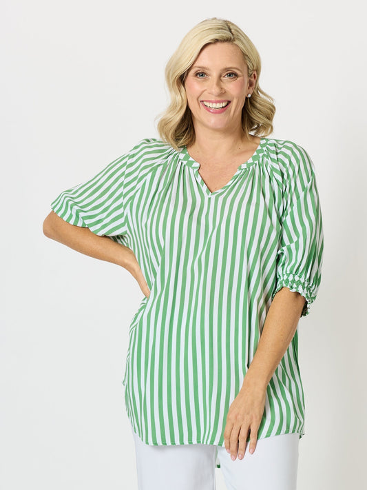Image of a model wearing Outerwear. Product name - Harlequin Stripe Print Top Apple White in Apple White colour by brand - Threadz