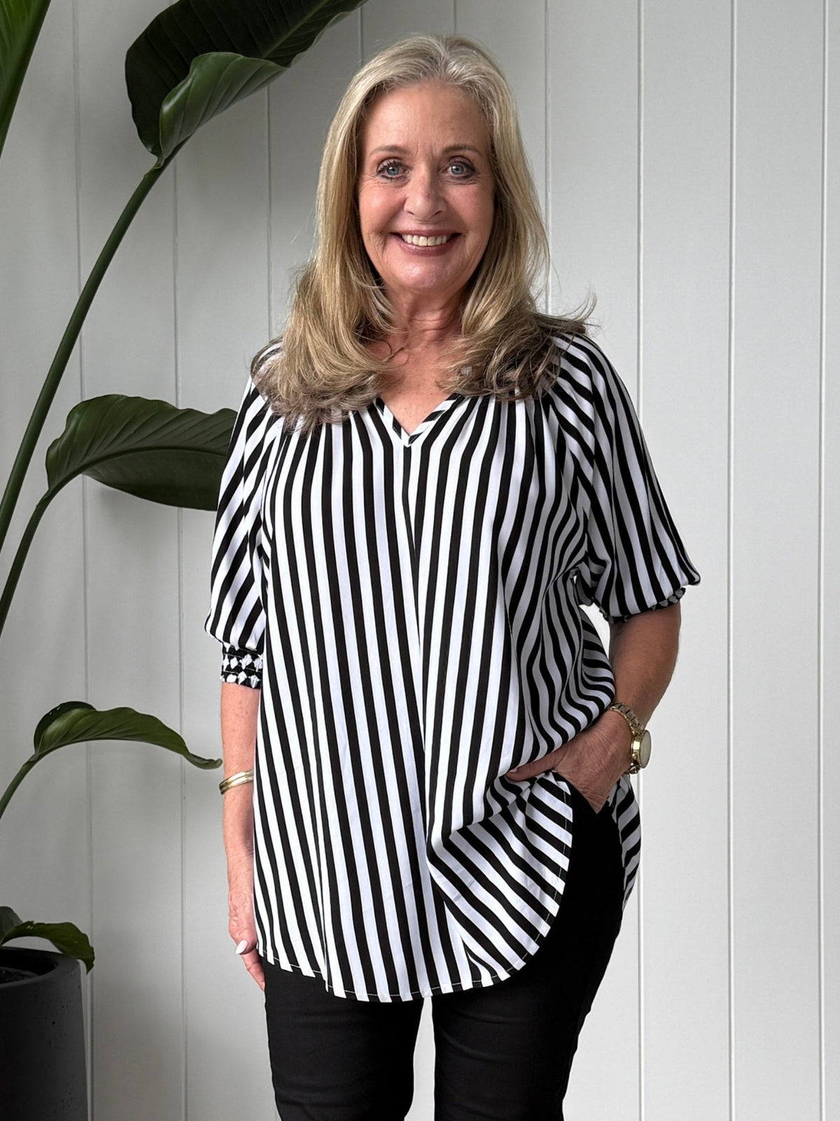 Image of a model wearing Outerwear. Product name - Harlequin Stripe Print Tunic Black/White in Black/White colour by brand - Threadz