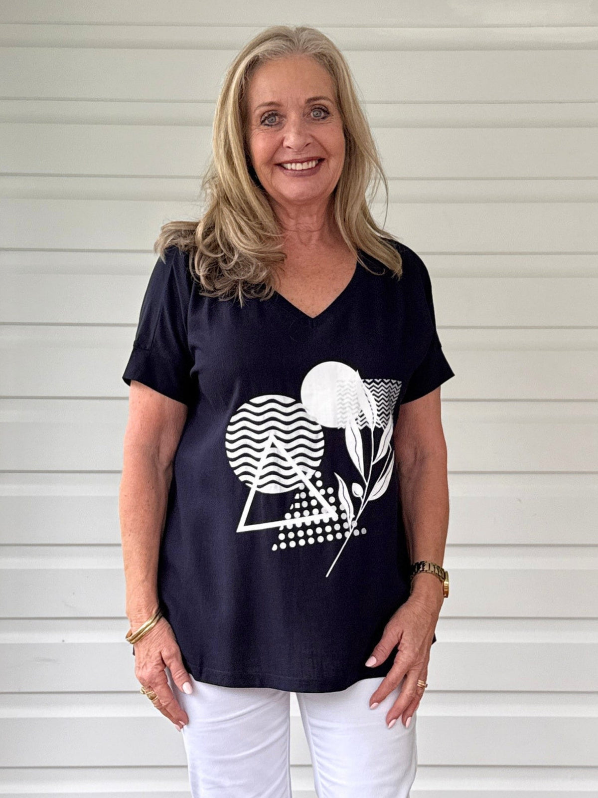 Image of a model wearing Tops. Product name - Orbit Print Top Navy in Navy colour by brand - Clarity