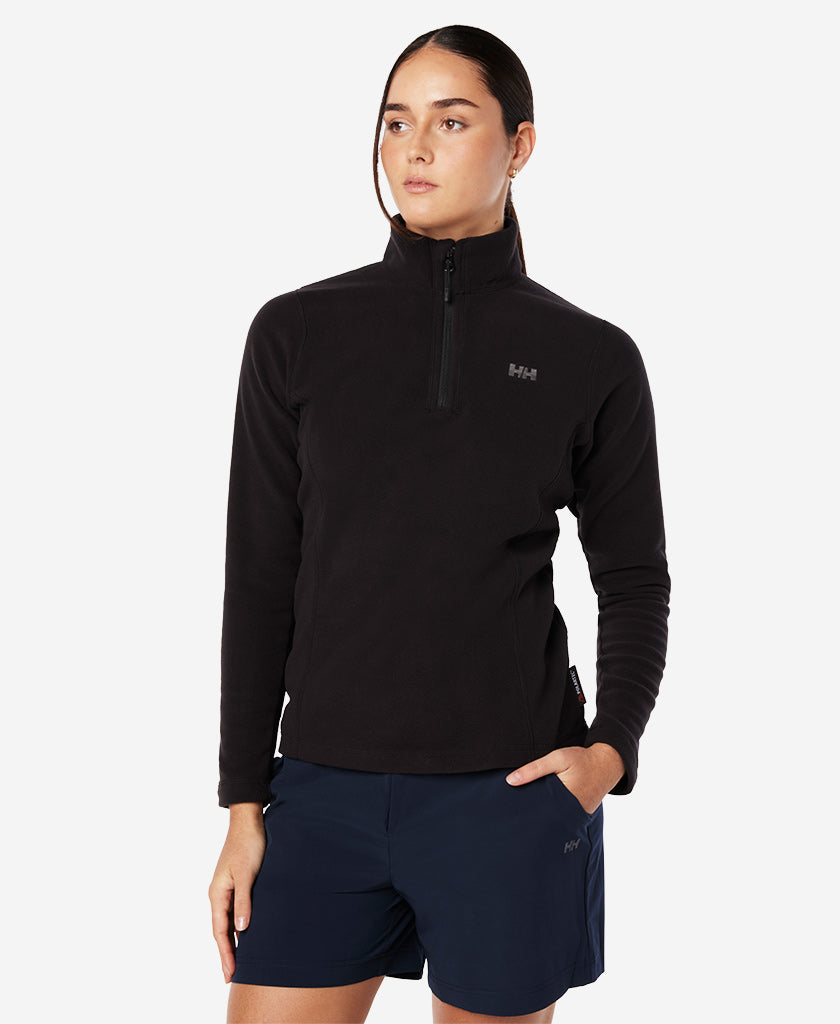 Image of a model wearing Outerwear. Product name - W DAYBREAKER 1/2 ZIP FLEECE, Black in Black colour by brand - Helly Hansen