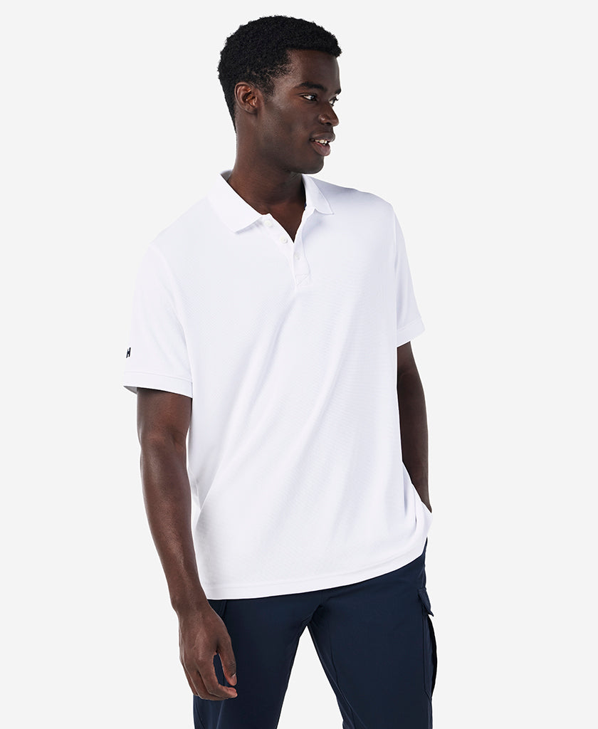 Image of a model wearing Tops. Product name - RIFTLINE POLO, White in White colour by brand - Helly Hansen