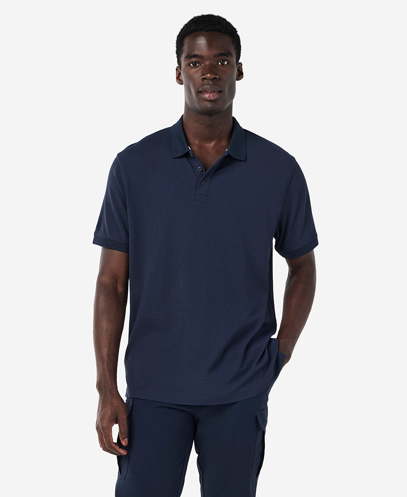 Image of a model wearing Tops. Product name - RIFTLINE POLO, Navy in Navy colour by brand - Helly Hansen