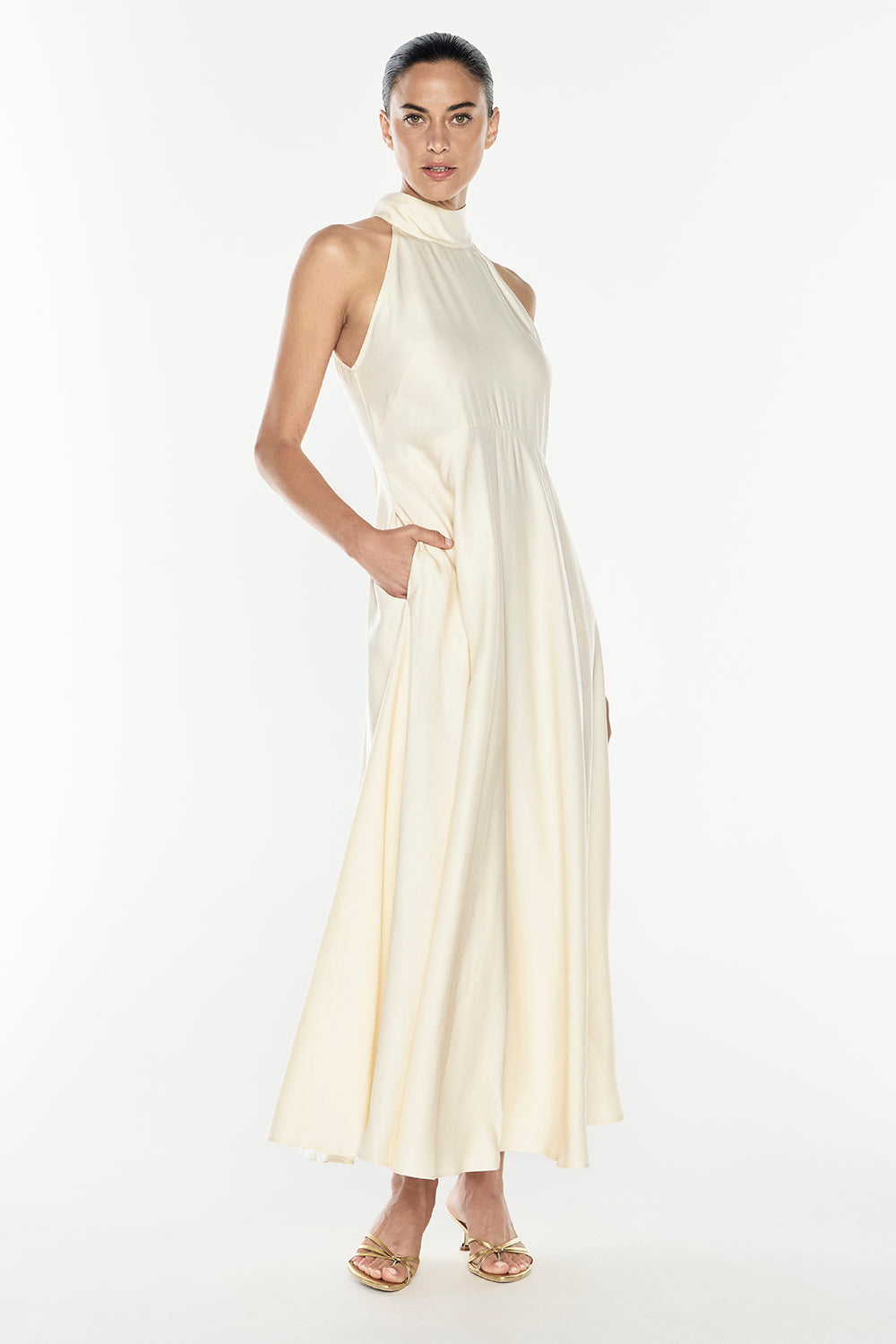 Image of a model wearing Tops. Productname: Love Philosophy Halter Dress in Champagne colour by brand - Manning Cartell