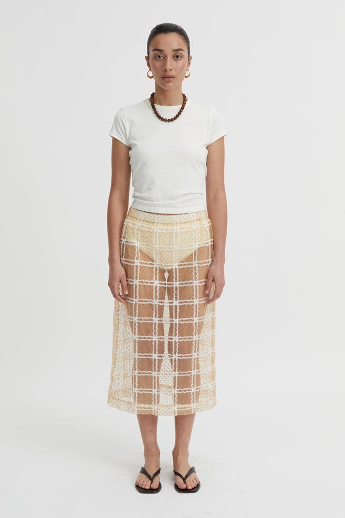 Image of a model wearing Skirts. Product name - Delphina Skirt Butter in Butter colour by brand - Blanca Studio