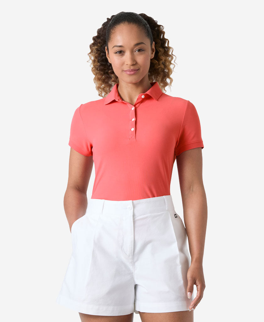 Image of a model wearing Tops. Product name - W CREWLINE POLO, Sunset Pink in Sunset Pink colour by brand - Helly Hansen