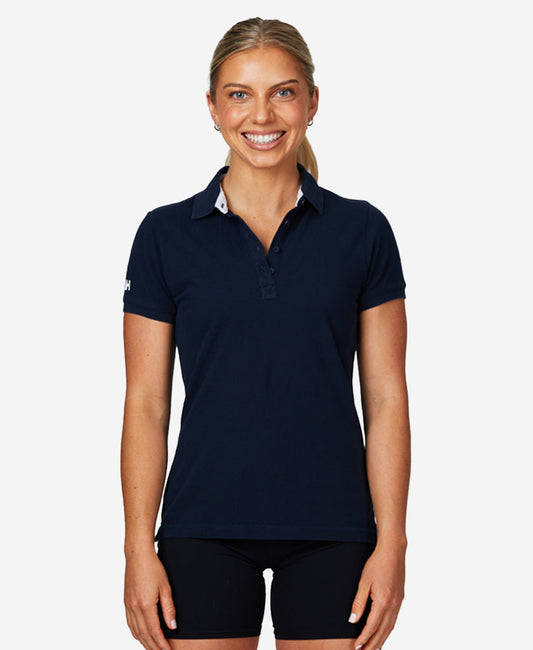 Image of a model wearing Tops. Product name - W CREW PIQUE 2 POLO, Navy in Navy colour by brand - Helly Hansen