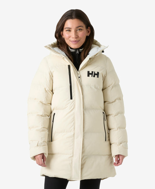 Image of a model wearing Outerwear. Product name - W ADORE PUFFY PARKA, Cream in Cream colour by brand - Helly Hansen
