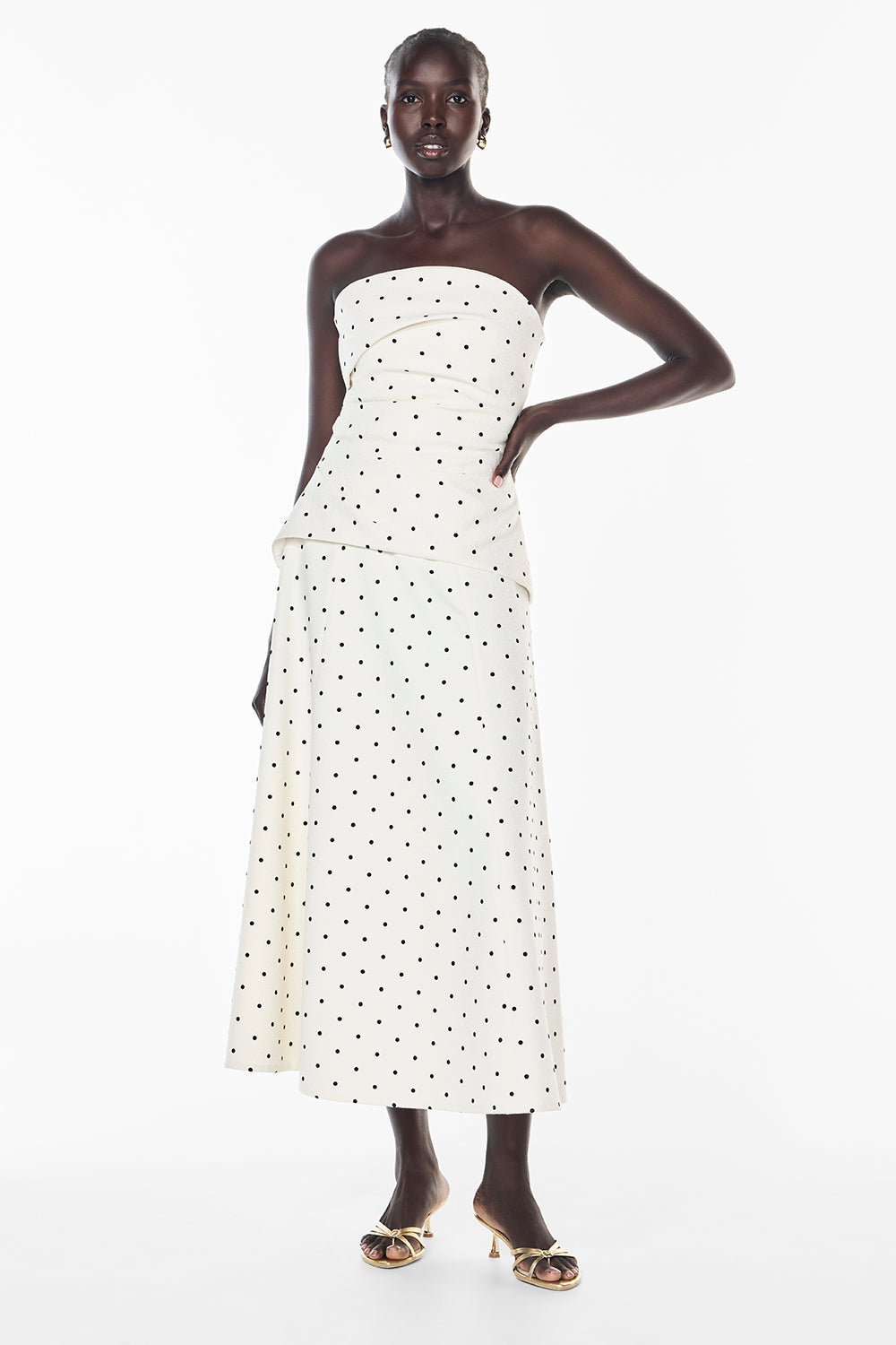 Image of a model wearing Skirts. Productname: Dot Dot Dash Skirt in IVORY/BLACK colour by brand - Manning Cartell