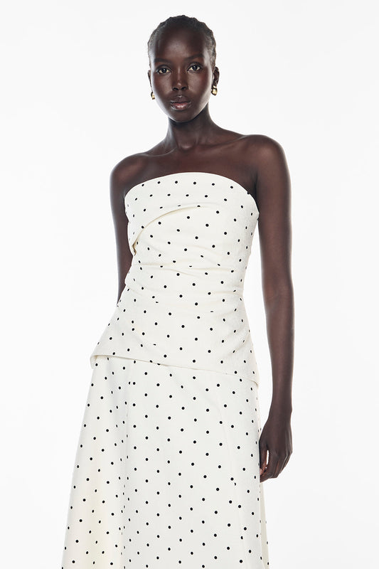 Image of a model wearing Tops. Productname: Dot Dot Dash Bustier in IVORY/BLACK colour by brand - Manning Cartell