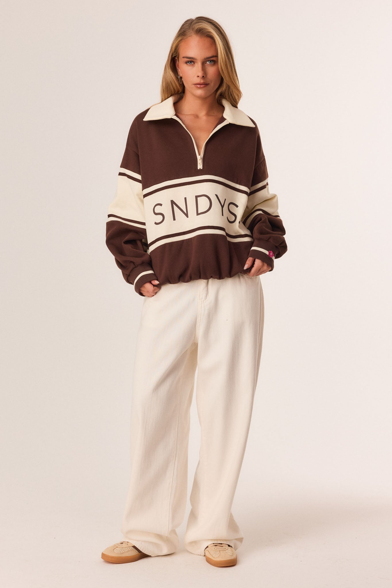 Image of a model wearing Outerwear. Productname: SNDYS SNDYS X PINK ELEPHANTS JUMPER in Chocolate colour by brand - SNDYS