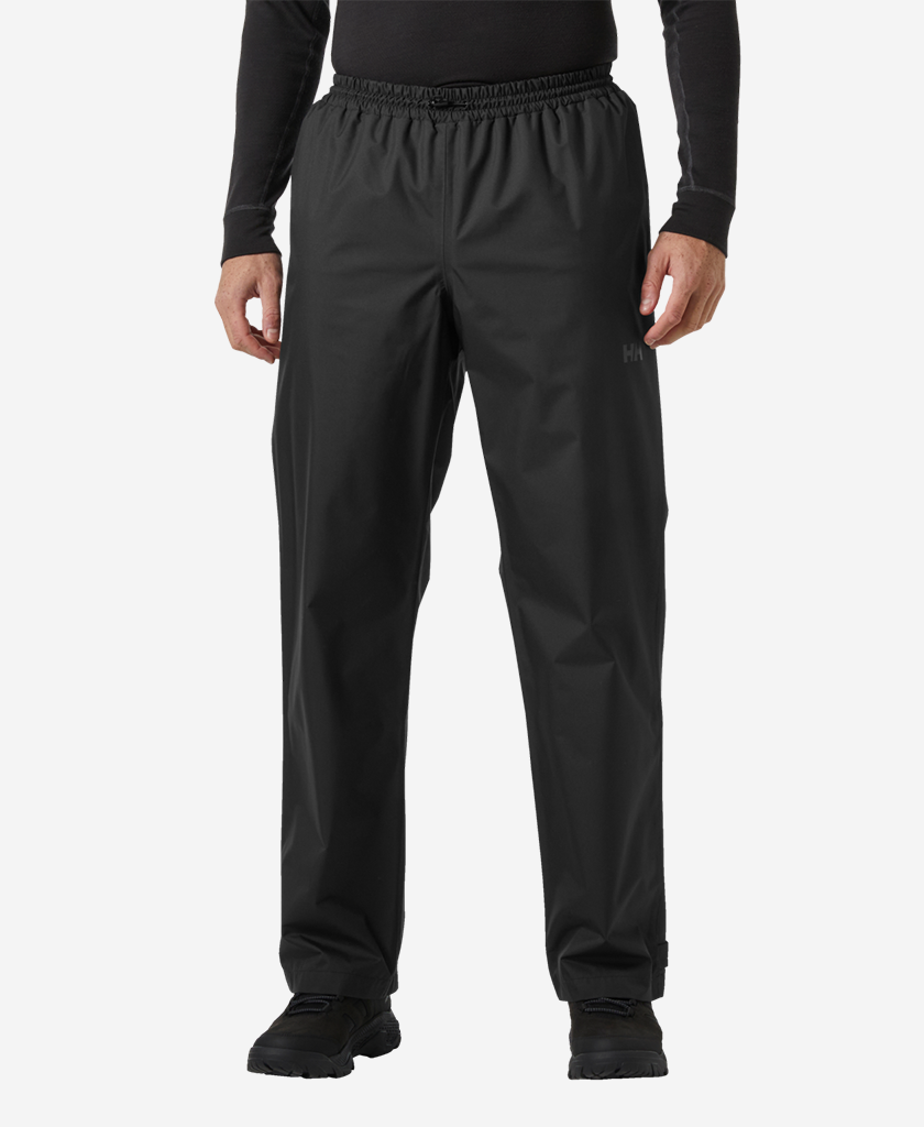 Image of a model wearing Pants. Product name - HH RAIN PANT, Black in Black colour by brand - Helly Hansen