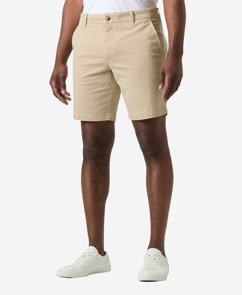 Image of a model wearing Shorts. Product name - BRYGGEN CHINO SHORTS, Khaki in Khaki colour by brand - Helly Hansen