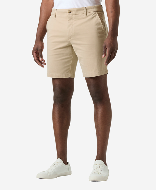 Image of a model wearing Shorts. Product name - BRYGGEN CHINO SHORTS, Khaki in Khaki colour by brand - Helly Hansen