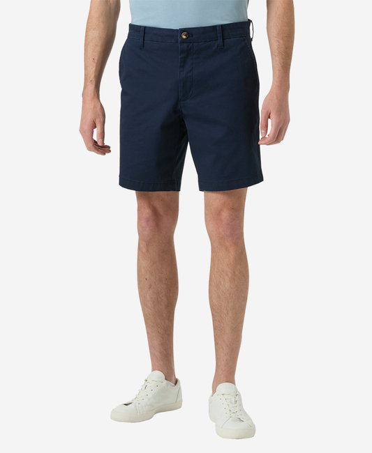 Image of a model wearing Shorts. Product name - BRYGGEN CHINO SHORTS, Navy in Navy colour by brand - Helly Hansen