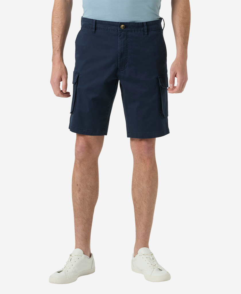Image of a model wearing Shorts. Product name - BRYGGEN CARGO SHORTS, Navy in Navy colour by brand - Helly Hansen