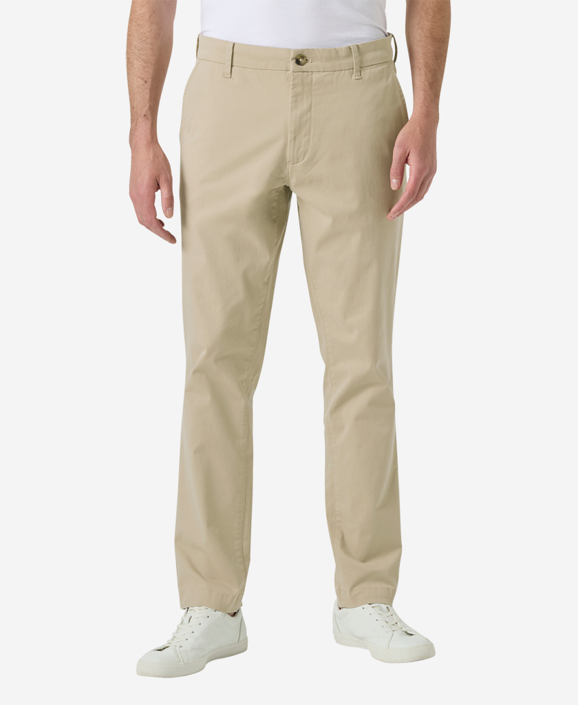 Image of a model wearing Pants. Product name - BRYGGEN CHINO PANT, Khaki in Khaki colour by brand - Helly Hansen