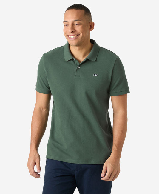 Image of a model wearing Tops. Product name - HUDSON POLO, Jungle Green in Jungle Green colour by brand - Helly Hansen