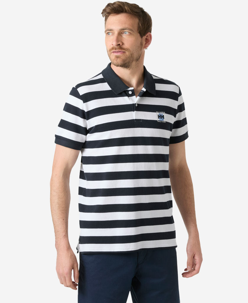 Image of a model wearing Tops. Product name - TOULON GRAPHIC POLO, Navy Yd Stripe in Navy Yd Stripe colour by brand - Helly Hansen