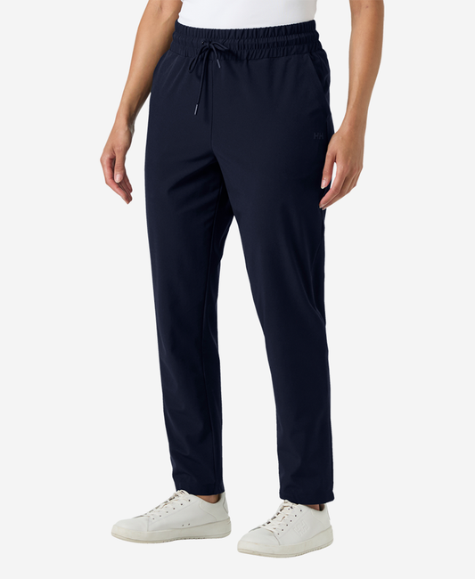 Image of a model wearing Pants. Product name - W THALIA PANT, Navy in Navy colour by brand - Helly Hansen