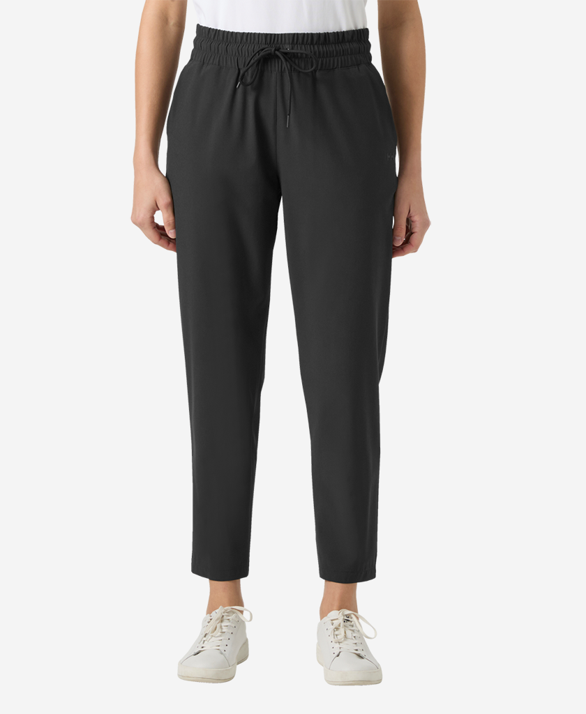 Image of a model wearing Pants. Product name - W THALIA PANT, Black in Black colour by brand - Helly Hansen