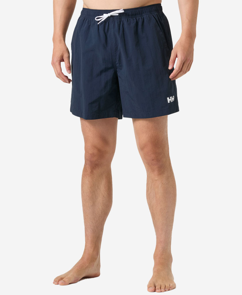 Image of a model wearing Shorts. Product name - CALSHOT TRUNK 7", Navy in Navy colour by brand - Helly Hansen