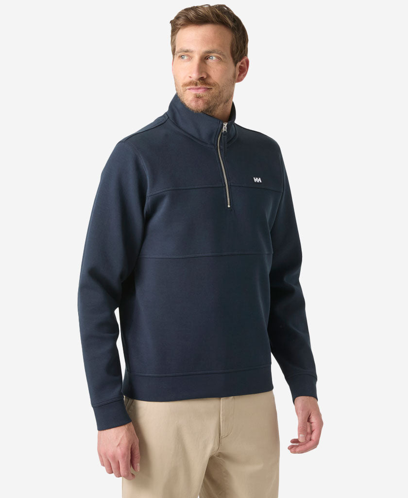 Image of a model wearing Outerwear. Product name - KOSTER SWEAT 1/2 ZIP, Navy in Navy colour by brand - Helly Hansen
