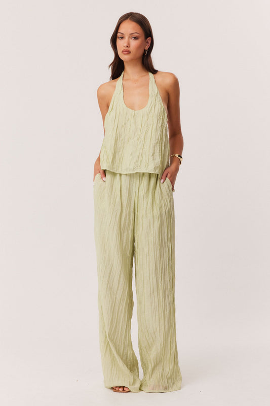 Image of a model wearing Pants. Productname: SNDYS BRANDI CRINKLE PANTS in Matcha colour by brand - SNDYS