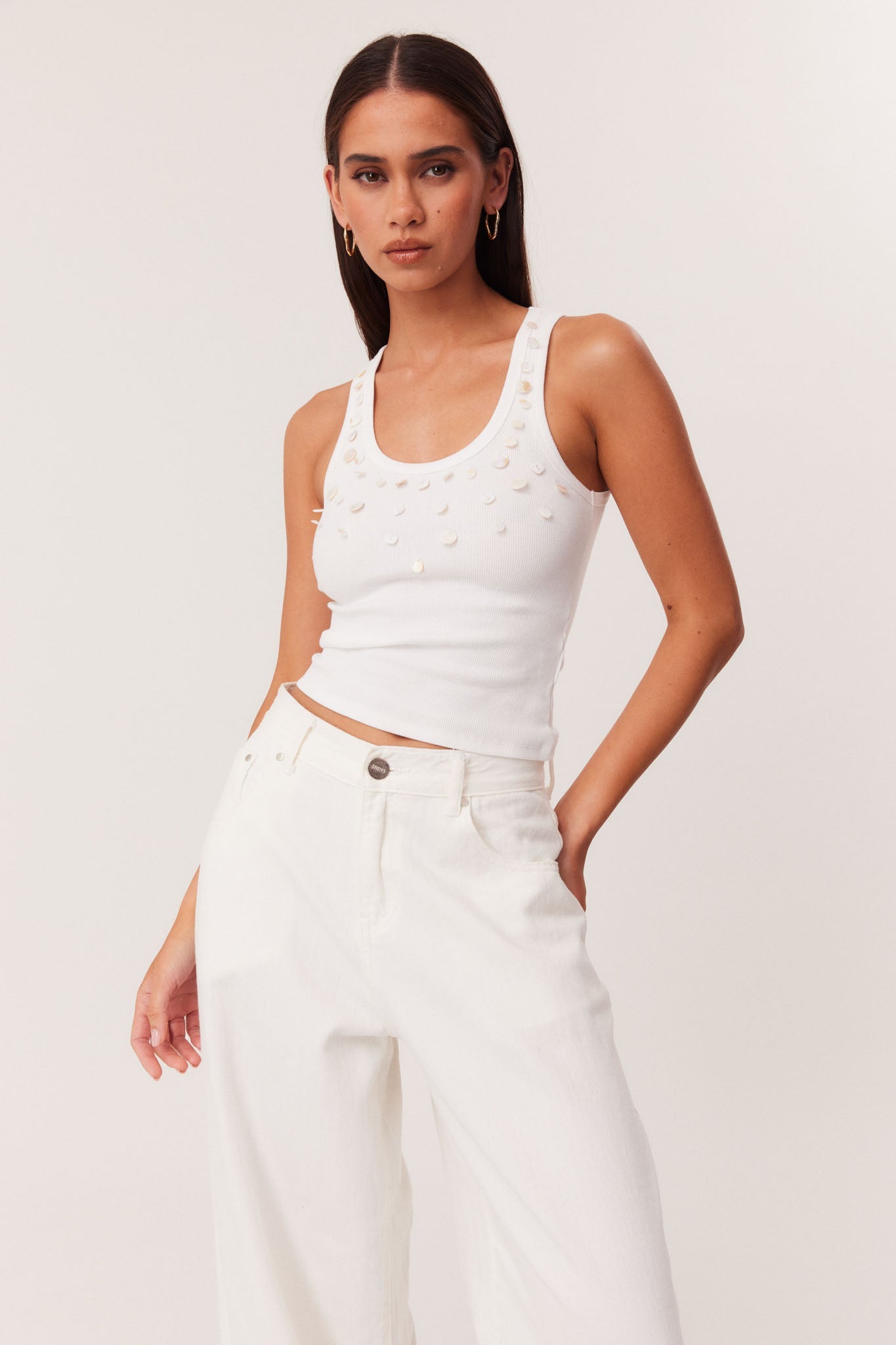 Image of a model wearing Tops. Productname: SNDYS FRAYA TANK TOP in Off White colour by brand - SNDYS
