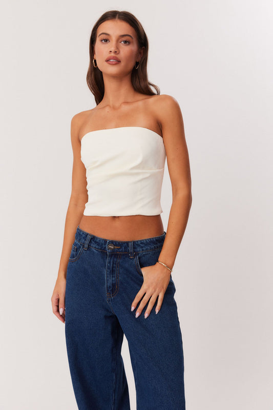 Image of a model wearing Tops. Productname: SNDYS ROMA STRAPLESS TOP in Ivory colour by brand - SNDYS