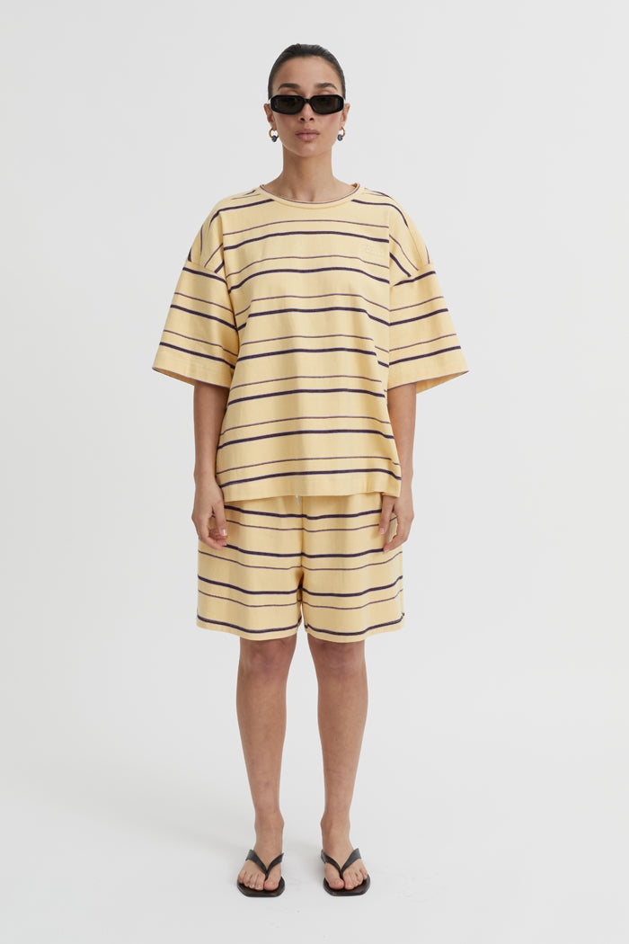 Image of a model wearing Shorts. Product name - Aerin Shorts Butter in Butter colour by brand - Blanca Studio