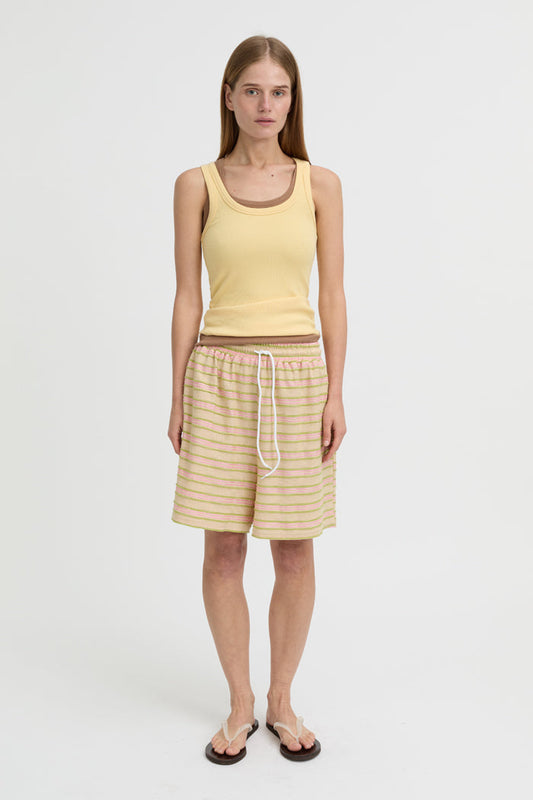Image of a model wearing Tops. Product name - Antonia Tank Butter in Butter colour by brand - Blanca Studio