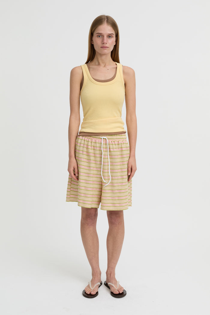 Image of a model wearing Shorts. Product name - Wynn Shorts Beige in Beige colour by brand - Blanca Studio