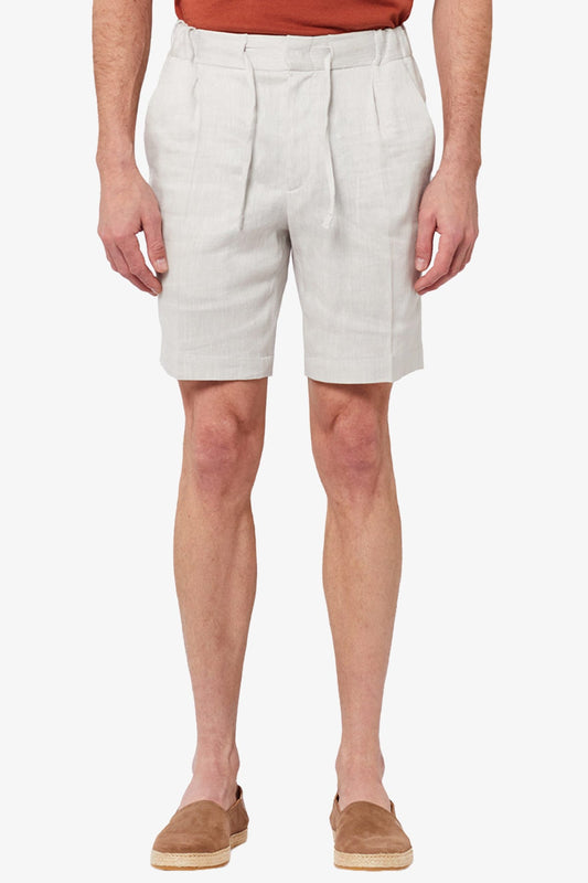 Image of a model wearing Shorts. Productname: Anthony Squires Tagliata - Stone Short in Stone colour by brand - Anthony Squires