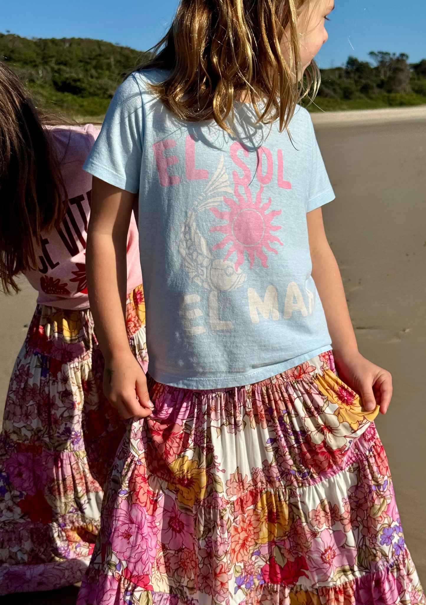 Image of a model wearing Tops. Productname: LITTLE AUGUSTE Little Auguste - Sol Classic Tee in Blue colour by brand - LITTLE AUGUSTE