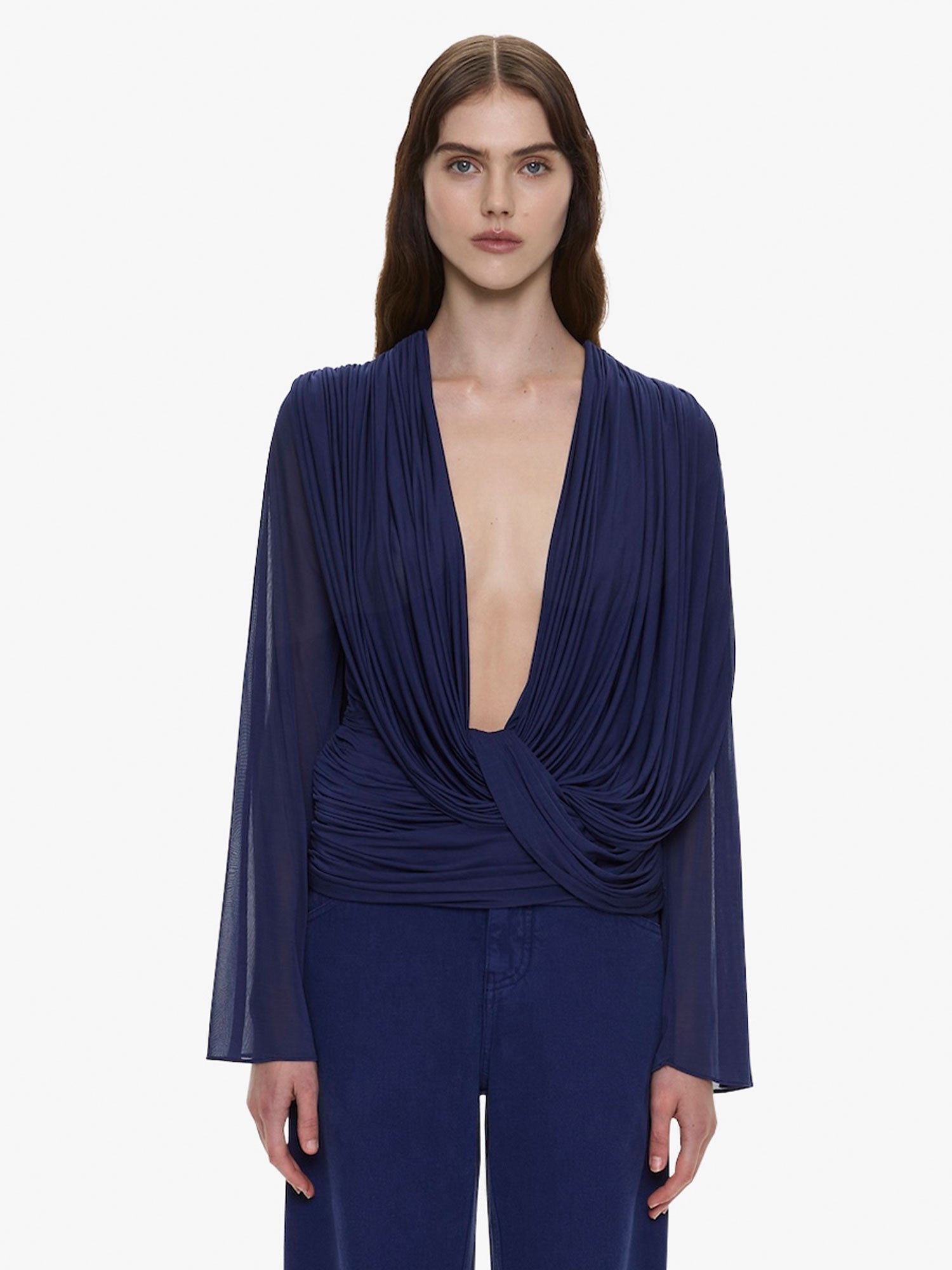 Image of a model wearing Tops. Product name - Ripple Drape Long Sleeve Top in Ink colour by brand - CHRISTOPHER ESBER