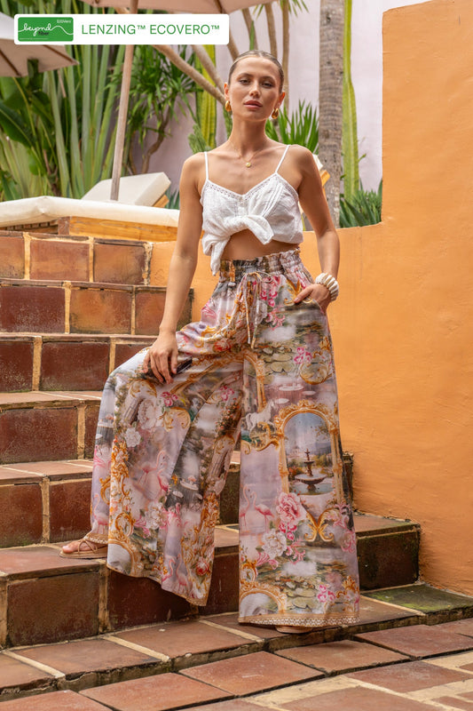 Image of a model wearing Pants. Productname: HEYCHIC Roselune Multicolour Abstract Wide Leg Pants in Multi colour by brand - HEYCHIC